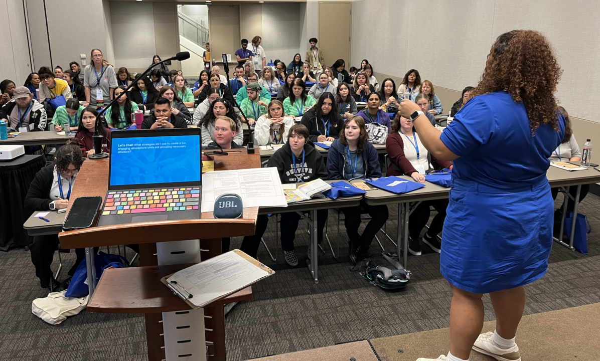 woman leading conference session