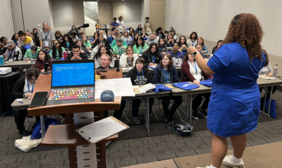 woman leading conference session