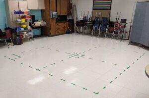 foursquare court marked in tape indoors