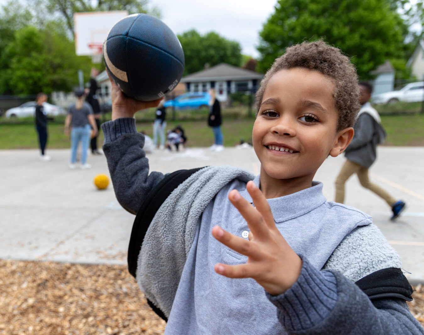 kid throwing football