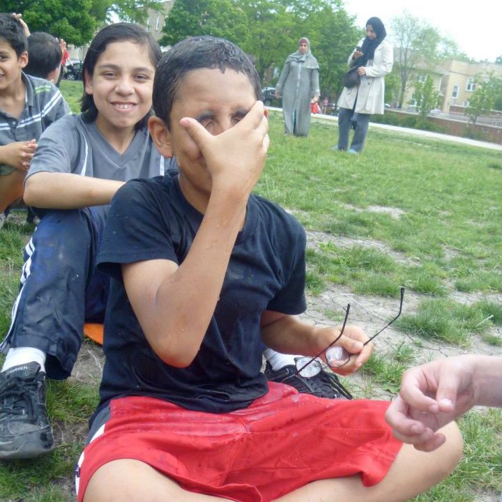 kids wiping water off face