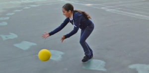 girl playing with dodgeball