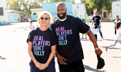 stars wearing Real Players Don't Bully shirt