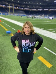 woman standing on football field