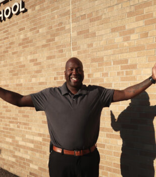 Mr. Watkins standing outside school