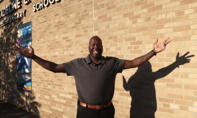 Mr. Watkins standing outside school