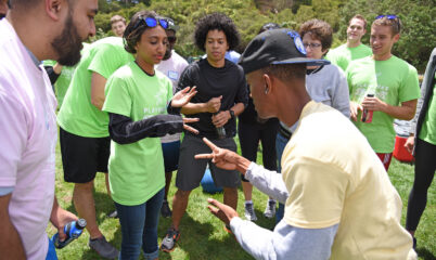 adults playing rock paper scissors