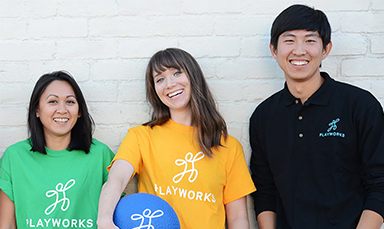 three people with Playworks shirts