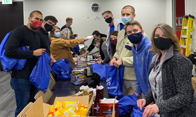 group of adults assembling kits